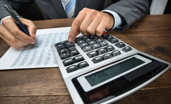 5953080_stock-photo-businessperson-doing-calculation-in-office.jpg